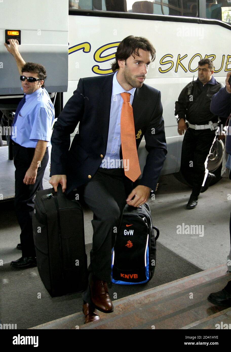 Dutch striker Ruud van Nistelrooy rushes past the press after his team's arrival at Macedonian capital Skopje, October 8, 2004. Macedonia will meet Netherlands on October 9 in their World Cup European zone Group one qualifying match. REUTERS/Oleg Popov  OP Stock Photo