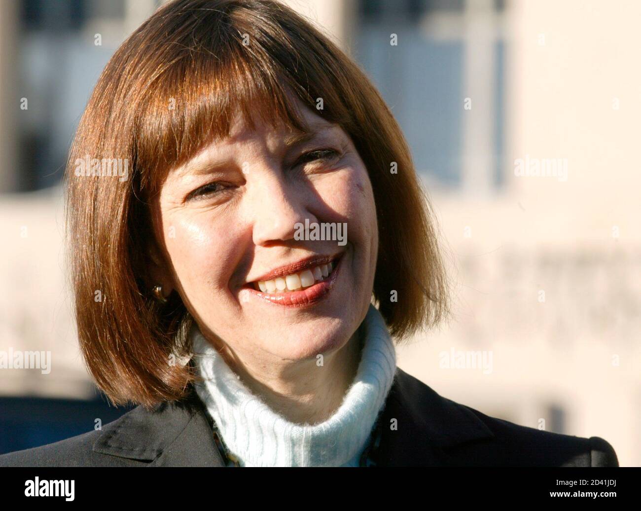 New York Times reporter Judith Miller smiles after she and Time Magazine reporter Matthew Cooper's appearance at the U.S. Court of Appeals for the District of Columbia in Washington, December 8, 2004. Cooper is one of two reporters facing up to 18 months in jail for refusing to testify about their contacts with confidential sources relating to the story about the unnamed Bush administration sources about the release of the name of CIA official Valerie Plame to the media 16 months ago. REUTERS/Yuri Gripas  YG Stock Photo