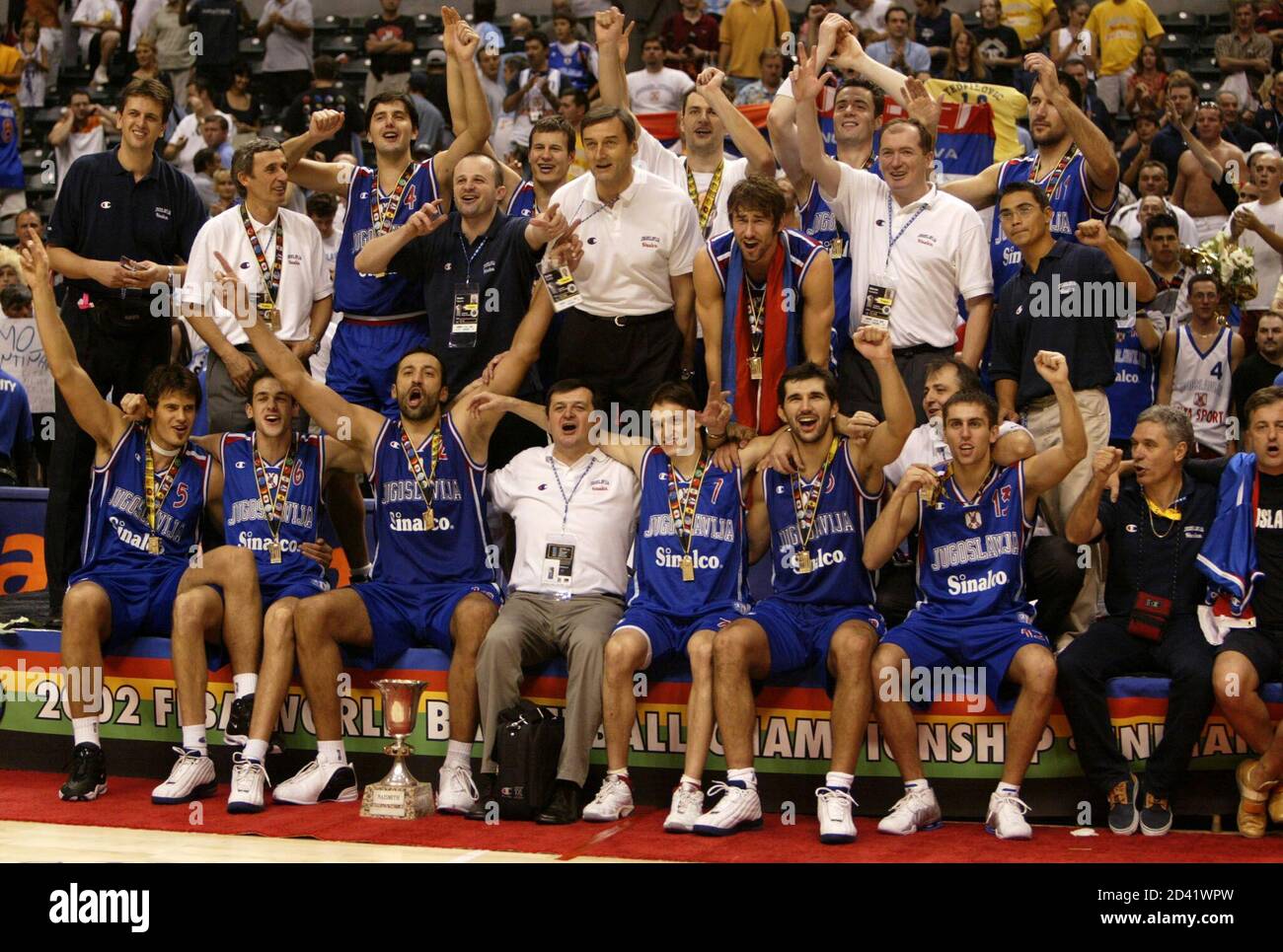The Yugoslavia basketball team celebrates its overtime win over Argentina  at the gold medal game at the 2002 World Basketball Championships in  Indianapolis, Indiana, September 8, 2002. Yugoslavia won its second  consecutive