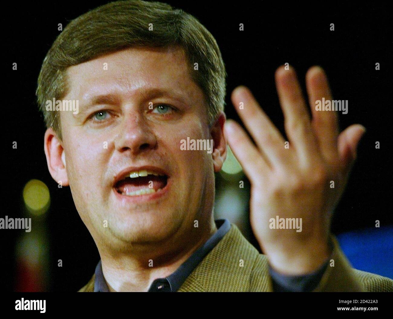 Conservative Party leader Stephen Harper addresses supporters during a campaign rally in Richmond, British Columbia May 29, 2004. Harper made a quick campaign stop in the lower mainland of British Columbia before returning to Ottawa. REUTERS/Andy Clark  AC Stock Photo