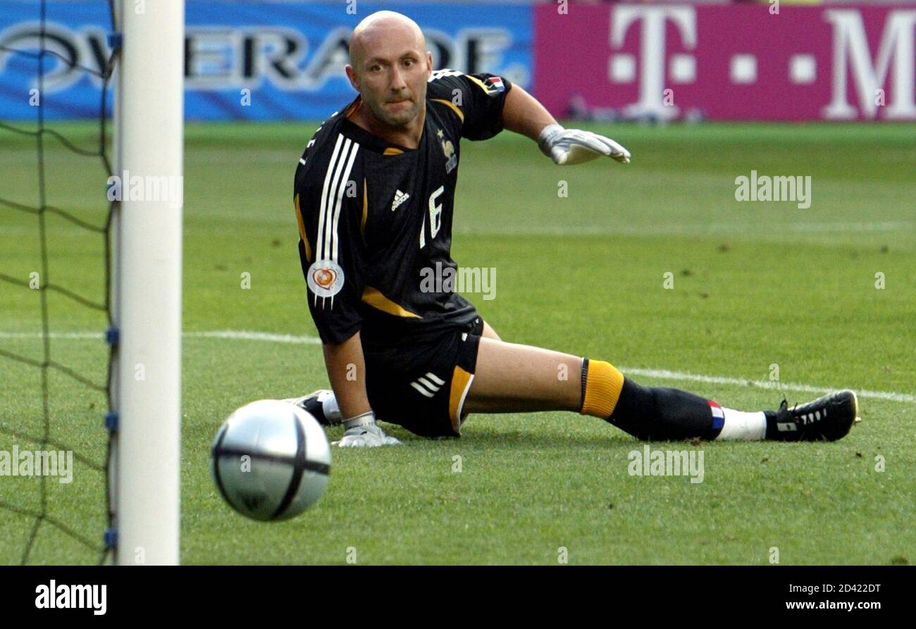 France S Goalkeeper Fabien Barthez Watches As A Shot From Switzerland S Johann Vonlanthen Rolls Into The Goal During Their Euro 04 Group B Match Soccer Match At The Ciudade De Coimbra Stadium In