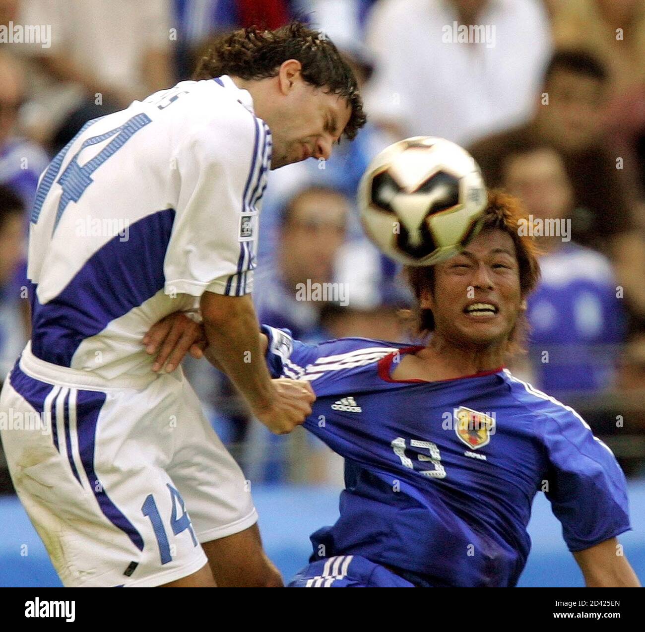 Greece's Takis Fyssas (L) challenges Japan's Atsushi Yanagisawa during  their Confederations Cup soccer match in Frankfurt, June 19, 2005.  REUTERS/Thomas Bohlen TB/AA Stock Photo - Alamy