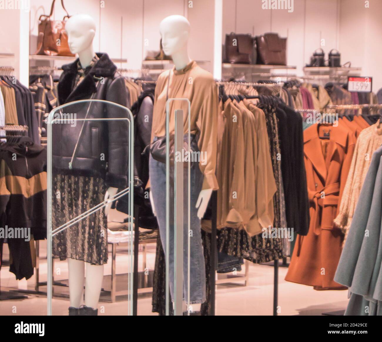 interior of fashion boutiques with modern clothing and mannequins Stock