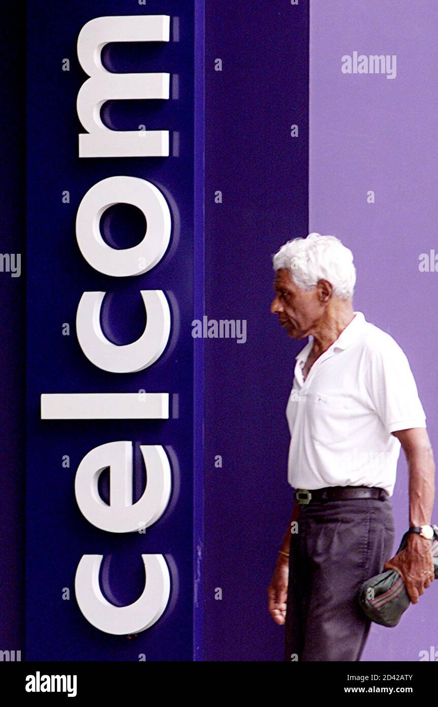 A Man Walks Into Celcom Office In Kuala Lumpur November 11 2002 Malaysia S Second Biggest Mobile Phone Firm Celcom Malaysia Bhd Denied A News Report That Said Additional Accounting Discrepancies Worth Some