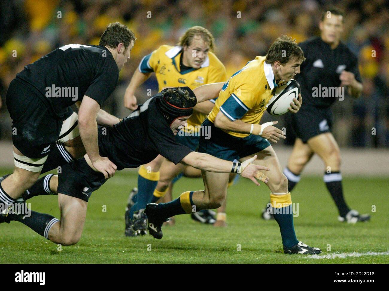 Ritchie Mccaw Of New Zealand S All Blacks Tackles Mat Rogers Of Australia S Wallabies At Tri Nations Test In Auckland Stock Photo Alamy