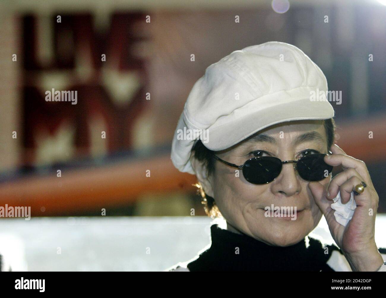 Artist Yoko Ono, the widow of John Lennon, looks over her glasses during  the opening of her exhibition 