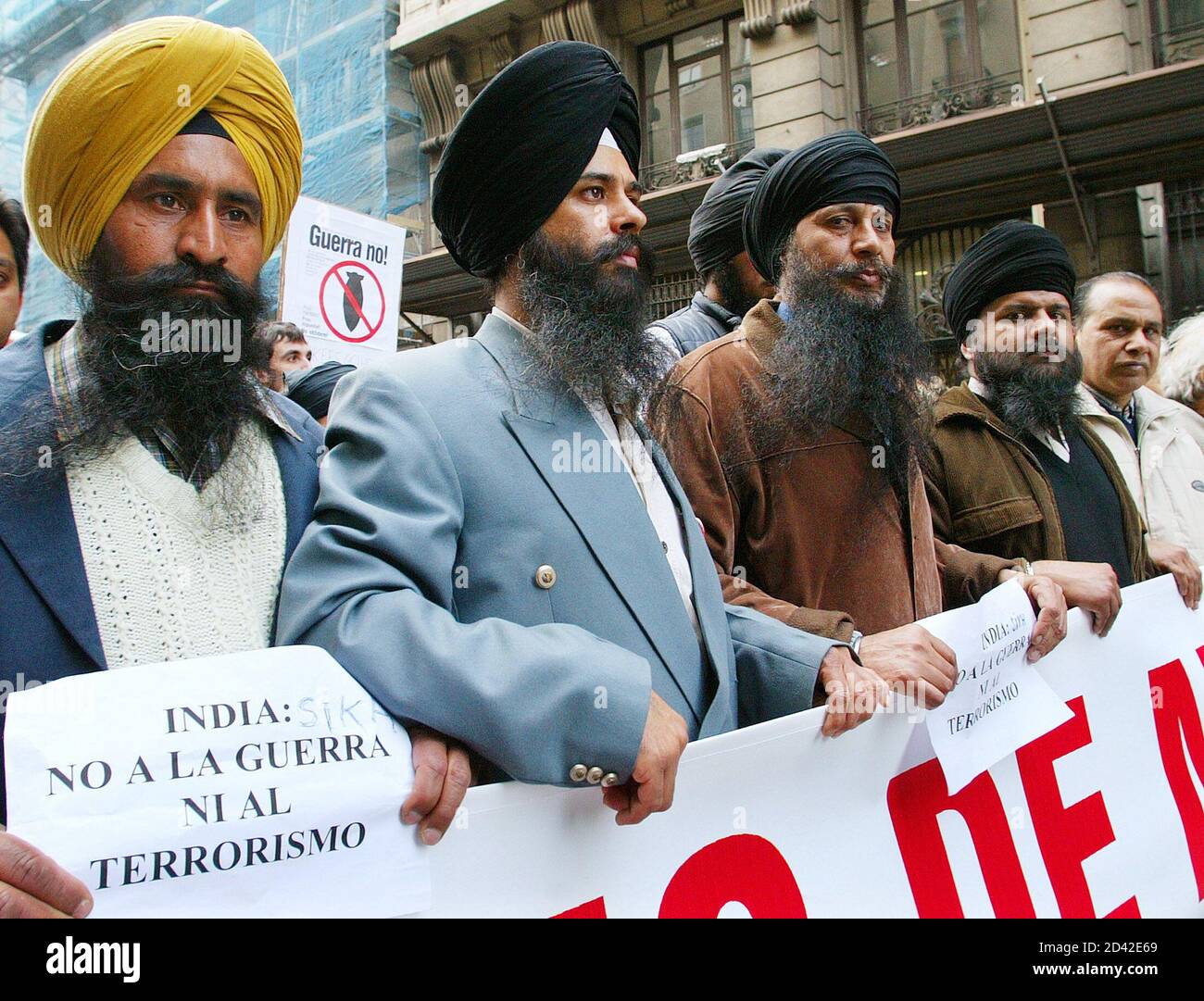 Members of the Indian community living in Catalonia take part in an anti-war march in central Barcelona on the first anniversary of the start of war in Iraq, March 20, 2004. Worldwide protests marked the anniversary of the war in Iraq on Saturday as tens of thousands demanded the U.S.-led coalition pull its troops out of the country scarred by a year of war and insurrection. REUTERS/Victor Fraile  GN/CRB Stock Photo