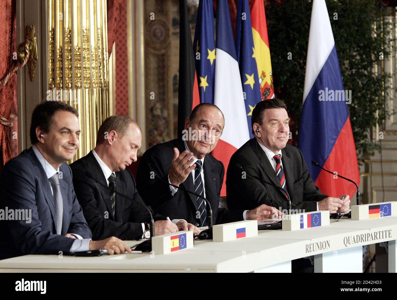 French President Jacques Chirac (2nd R), asks for questions during a press conference with Spanish Prime Minister Jose Luis Rodriguez Zapatero (L), Russian President Vladimir Putin (2nd L) and German Chancellor Gerhard Schroeder (R) after a meeting at the Elysee Palace in Paris March 18, 2005. Stock Photo