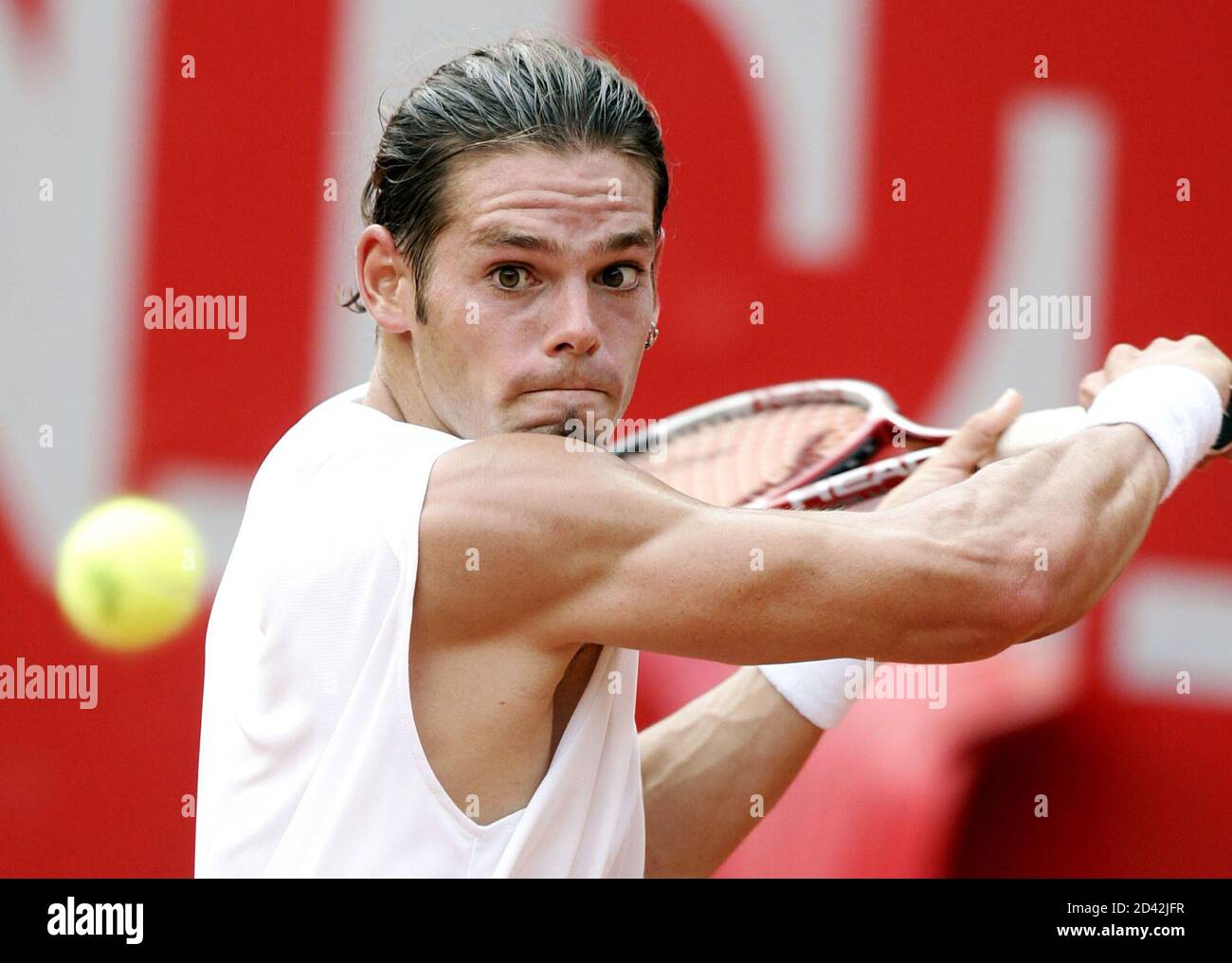 Austria's Koellerer eyes the ball during a first round match against Tabara  of the Czech Republic at the Kitzbuehel Open tennis tournament in Austria.  Austria's Daniel Koellerer eyes the ball during a