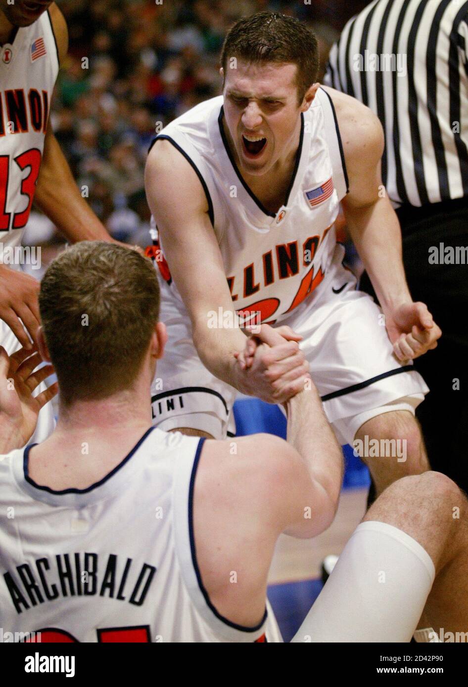 University of Illinois Sean Harrington (R) celebrates with Robert Archibald  after Archibald sunk a basket and got fouled during first half action  against Creighton in round two of the NCAA division one