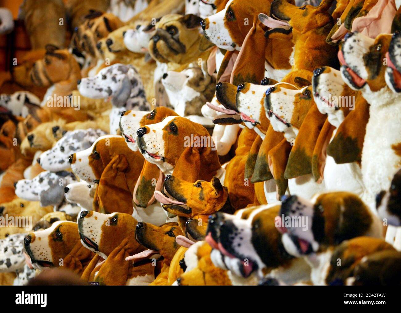 Stuffed toy dogs stand on display at the Crufts dog show in Birmingham, March 6, 2003.  The 100th Crufts show, which was founded in 1891 by entrepreneur [Charles Cruft], is expected to attract more than 170 breeds of dog who will compete for this year's best-in-show title, awarded on the competition's final day on Sunday. Stock Photo