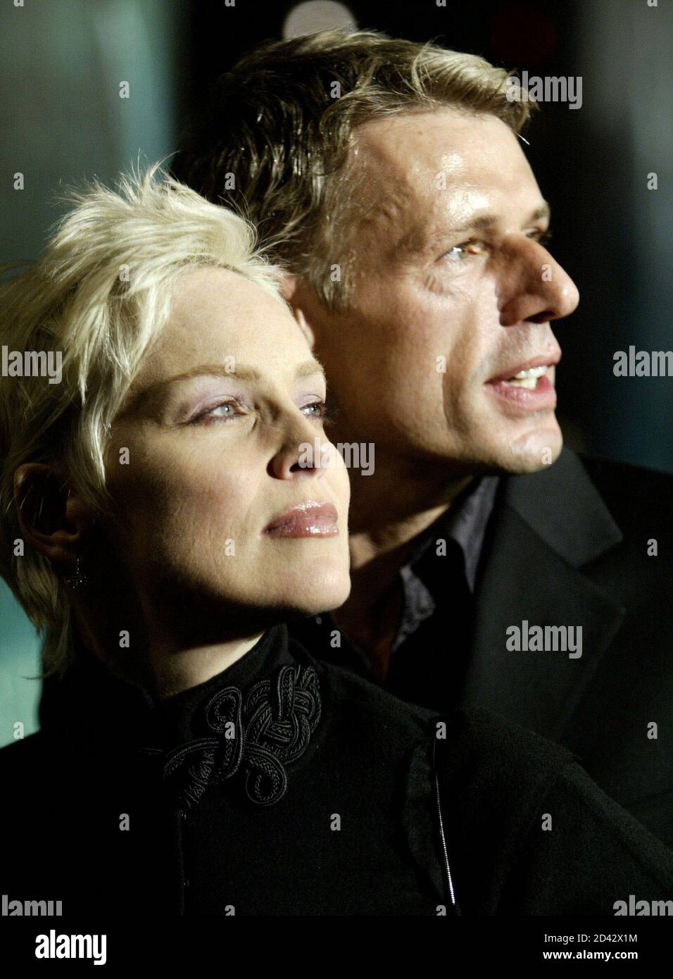 Lambert Wilson (R), a cast member in the sci-fi action thriller motion picture 'The Matrix Revolutions,' poses with actress Sharon Stone as they arrive during the premiere of the film, at the Disney Concert Hall in Los Angeles, California, October 27, 2003. Stock Photo