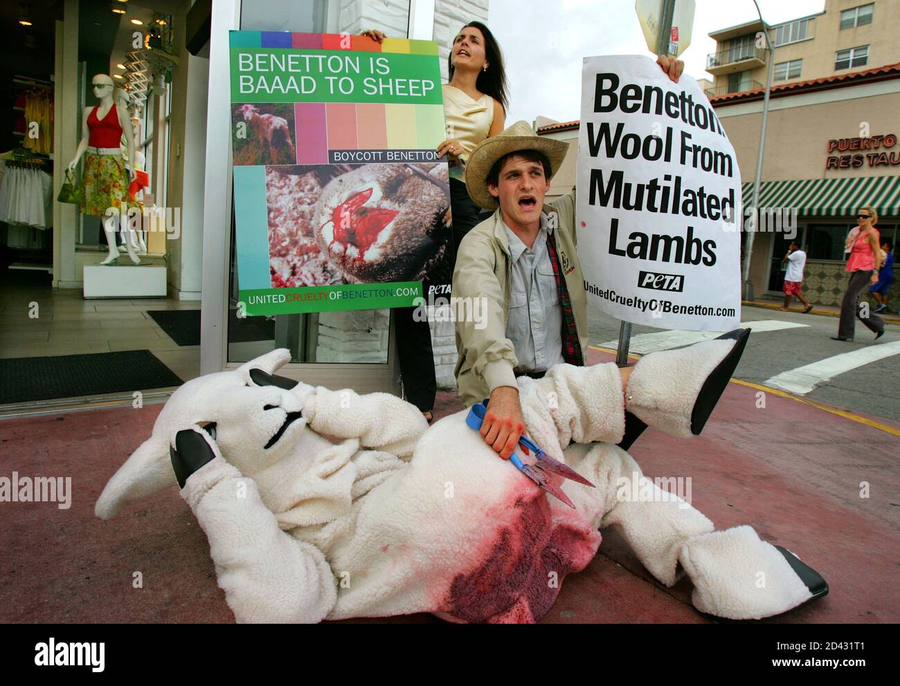 Members of PETA (People for the Ethical Treatment of Animals) protest in  front of a Benetton store against the 'Mulesing', a mutilation of sheep  used by Australian farmers at the wool industry,