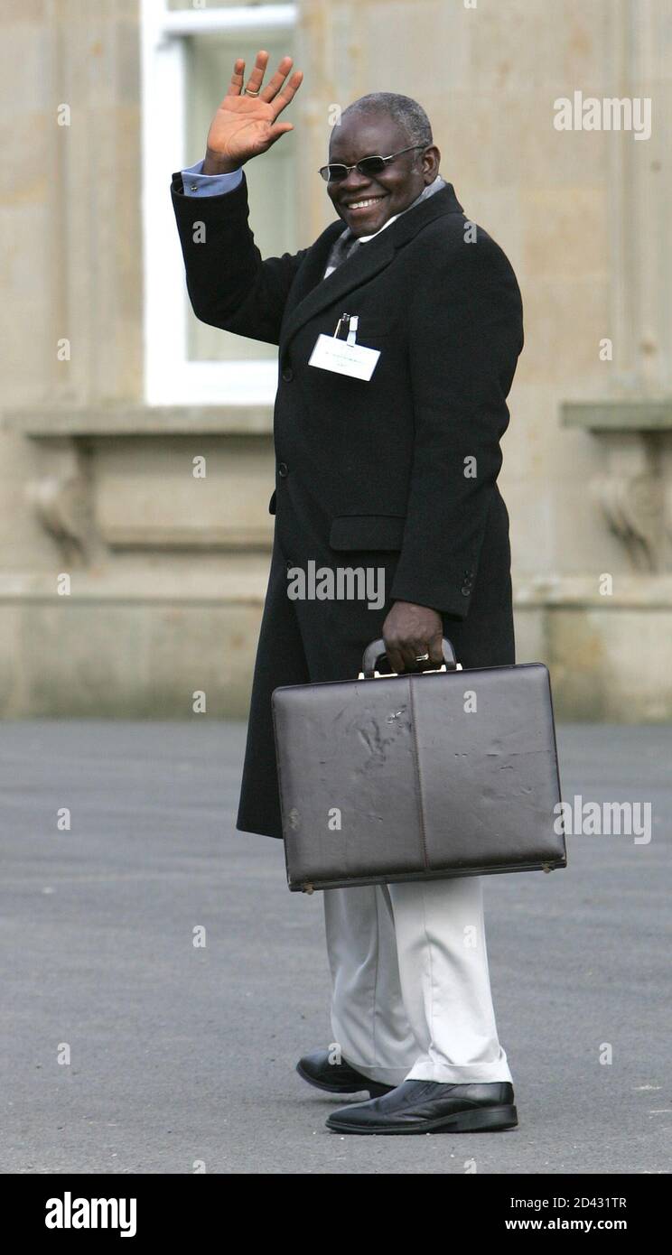 Primate of Nigerian Anglican Church Akinola waves as he leaves Dromantine Conference Centre in Northern Ireland.  Primate of the Anglican Church in Nigeria, the Most Revd Peter Akinola, waves as he leaves Dromantine Conference Centre near Newry in Northern Ireland, February 25, 2005. The worldwide Anglican church headed down the road to schism on Friday after U.S. and Canadian clerics were asked to withdraw from key Anglican meetings in a deepening row over gay bishops. REUTERS/Paul McErlane Stock Photo