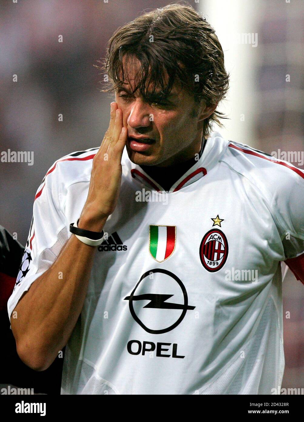 ac-milans-captain-maldini-holds-his-face-during-the-champions-league-semi-final-second-leg-soccer-match-against-psv-eindhoven-in-eindhoven-ac-milans-captain-paolo-maldini-holds-his-face-during-the-champions-league-semi-final-second-leg-soccer-match-against-psv-eindhoven-at-the-phillips-stadium-in-eindhoven-the-netherlands-may-4-2005-reutersjerry-lampen-2D4328R.jpg