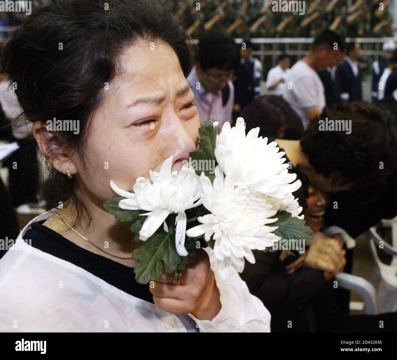 Relatives of soldiers killed during June 19 shooting incident, cry during funeral at military hospital in Songnam.  Relatives of soldiers killed during the June 19 shooting incident, cry during a funeral at a military hospital in Songnam, about 25 km (16 miles) southeast of Seoul, June 25, 2005. A bullied private, officially identified only as 'Kim', tossed a grenade on June 19, 2005 among barrack comrades and then opened fire, killing 8 soldiers, at a guard post in Yonchon, about 60 km (40 miles) north of Seoul, the Defence Ministry said. REUTERS/Stringer/Pool Stock Photo