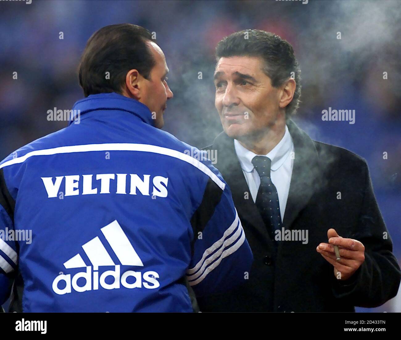 FC Schalke's Manager Rudi Assauer (R) congratulates his Dutch coach Huub  Stevens (L) after winning a