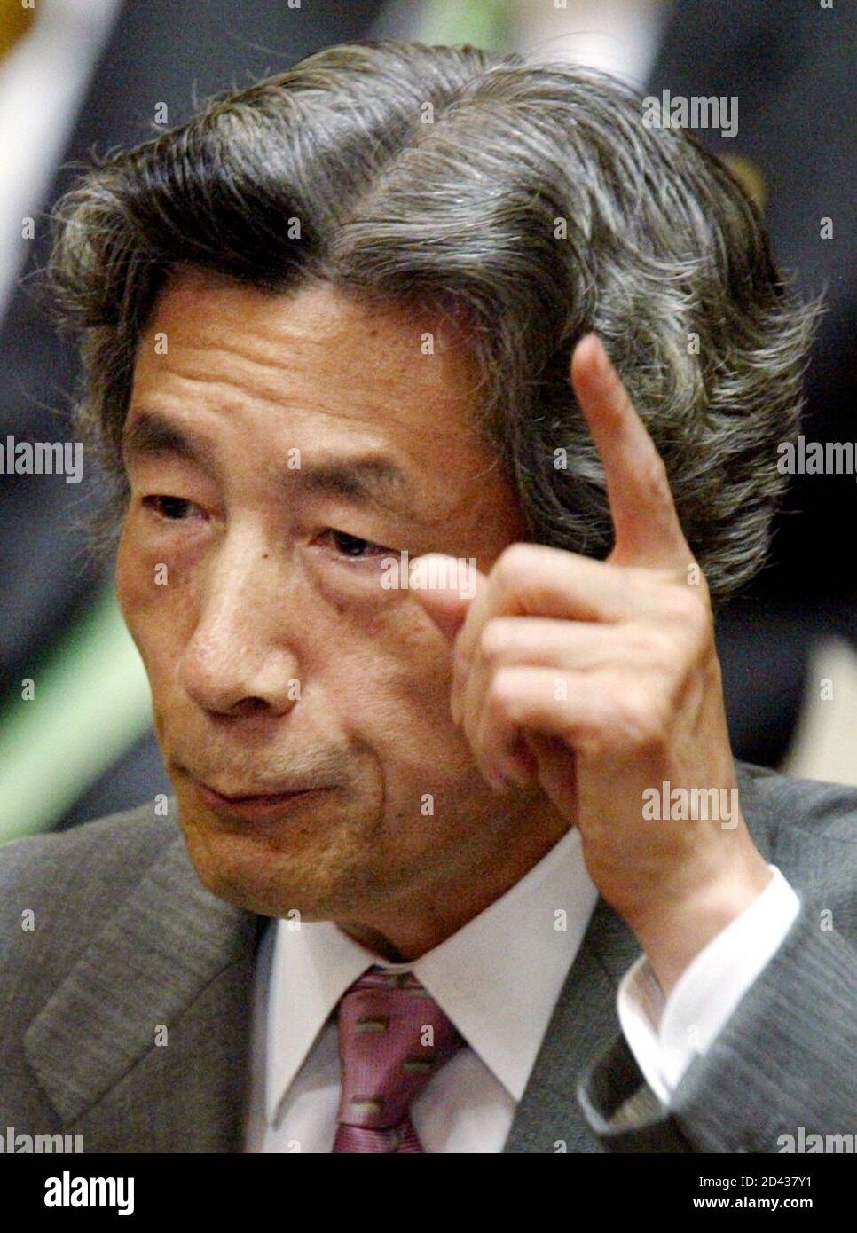 Japanese Prime Minister Junichiro Koizumi answers a question from opposition at a Lower House budget committee session of parliament in Tokyo October 24, 2002. Risking a revolt in his own party, Koizumi stood firm in support of his besieged banking regulators on Thursday, backed by signs the Bank of Japan would help ease the paign of tough reforms. REUTERS/Toshiyuki Aizawa  TA/CP Stock Photo
