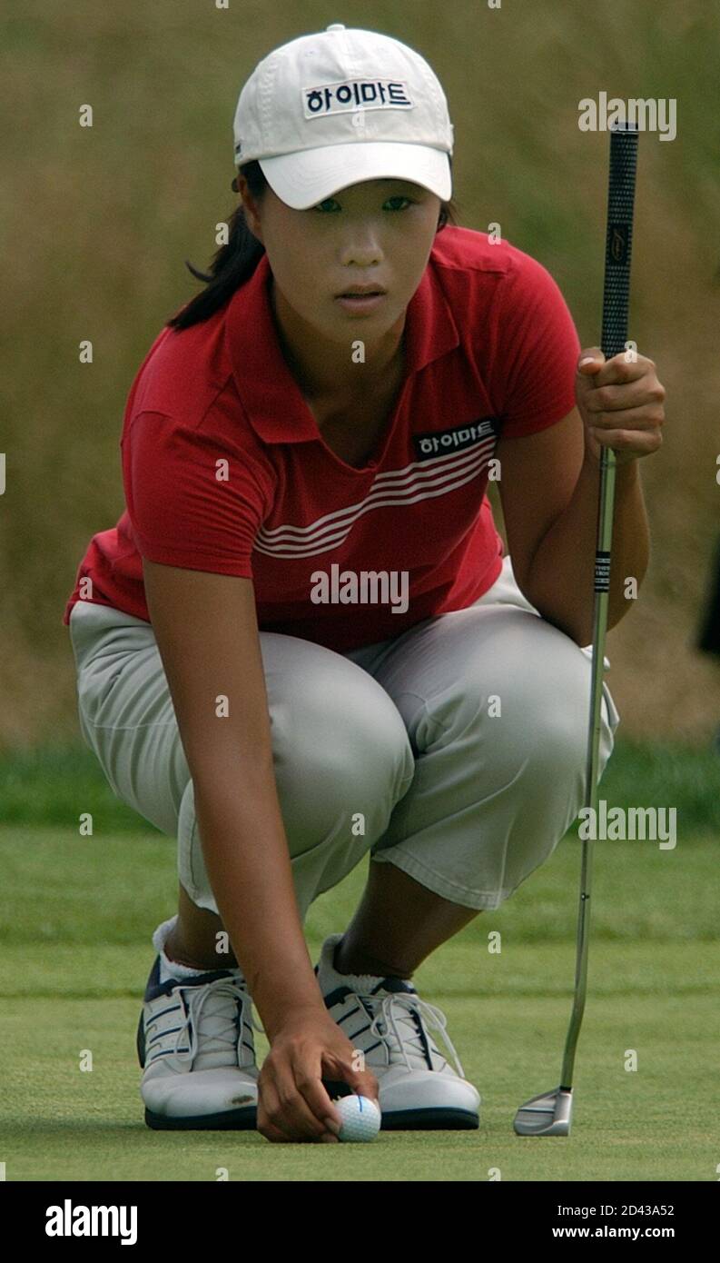 Ara Koh from Souoth Korea lines up het putt on the fourteenth hole during  first round play of the ShopRite LPGA Classic in Atlantic City, New Jersey,  June 27, 2003. REUTERS/Tim Shaffer