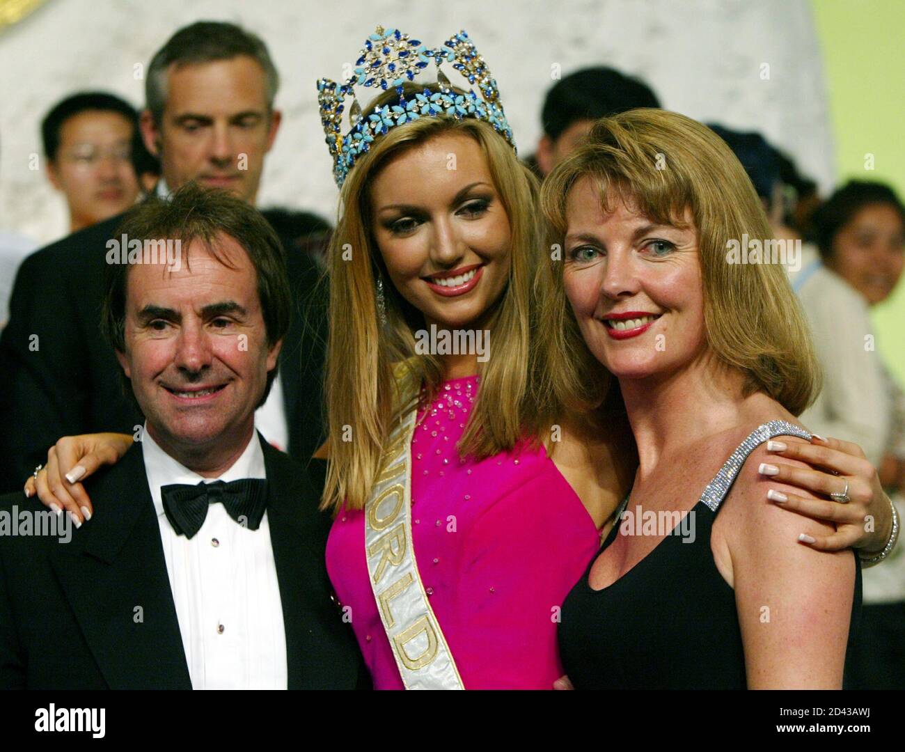 Miss Ireland Rosanna Davison (C) poses with her parents singer Chris de Burgh (L) and wife Diane after being crowned Miss World 2003 in Sanya, in China's tropical island of Hainan, December 6, 2003. Stock Photo