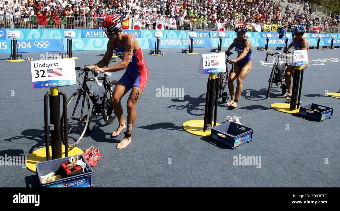 Lindquist Taormina and Williams of the US arrive in the transition area at the  end of the cycle section of the women's triathlon event at the Athens 2004  Olympic Games. Barbara Lindquist,