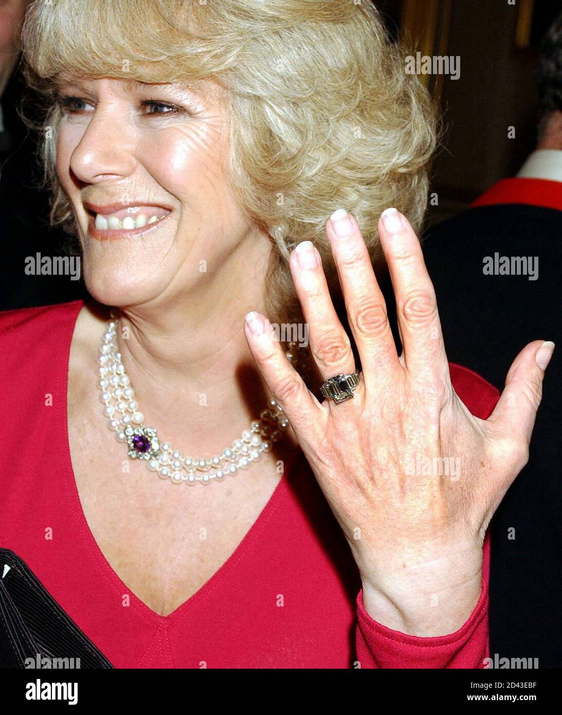 Parker Bowles' engagement ring is seen as she makes her first public  appearance with Britain's Prince Charles since they announced their wedding  engagement at Windsor Castle. Camilla Parker Bowles holds up her