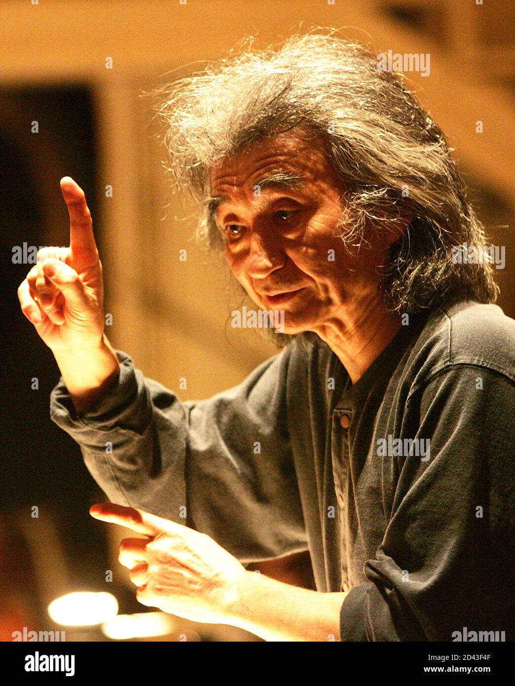 Maestro Seiji Ozawa of Japan conducts the Vienna State Opera Orchestra during a dress rehearsal of Giacomo Puccini's opera 'Manon Lescaut' in Vienna May 30, 2005. The opera is directed by Robert Carsen of Canada and will have its premiere on June 4. REUTERS/Herwig Prammer REUTERS   PR/ Stock Photo