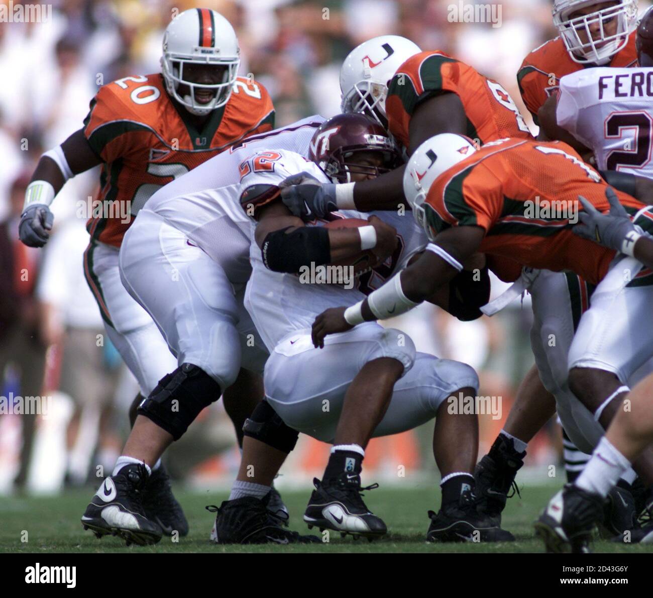 Miami Hurricanes defensive stops Virginia Tech running back Lee Suggs (C)  in the second quarter of play a the Orange Bowl November 4, 2000. CB/JP  Stock Photo - Alamy
