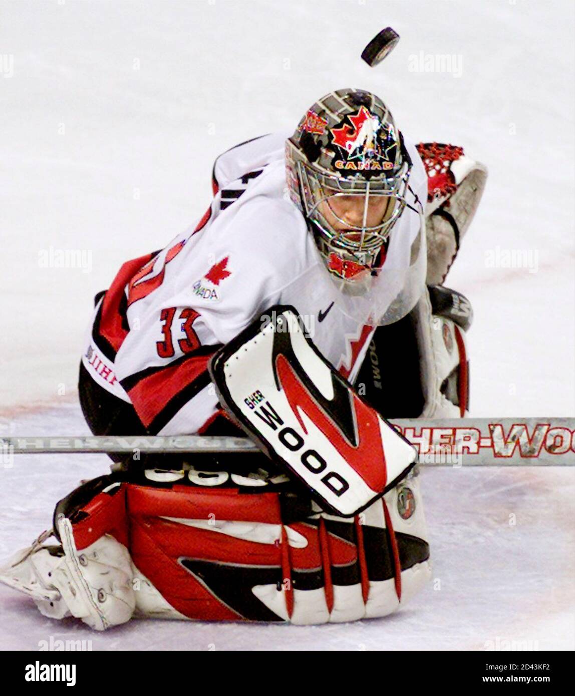Goalie Kim St-Pierre of Canada deflects away a United States shot on goal  in the third period of the women's gold medal Olympic ice hockey game,  February 21, 2002 at the Salt