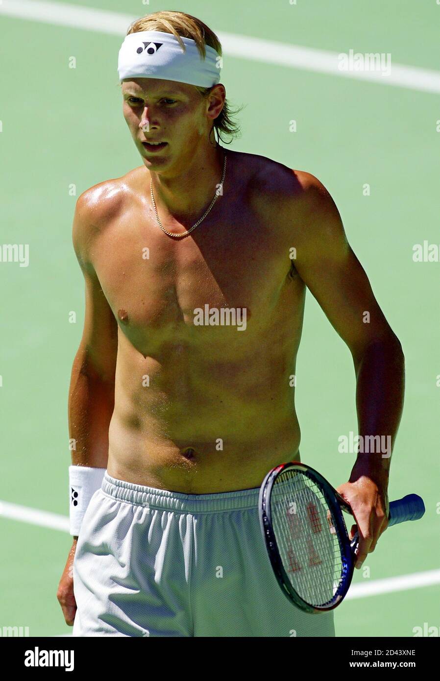 Joachim Johansson from Sweden practices without a shirt on Rod Laver Arena  during a warm-up for the Australian Open in Melbourne. Joachim Johansson  from Sweden practices without a shirt on Rod Laver