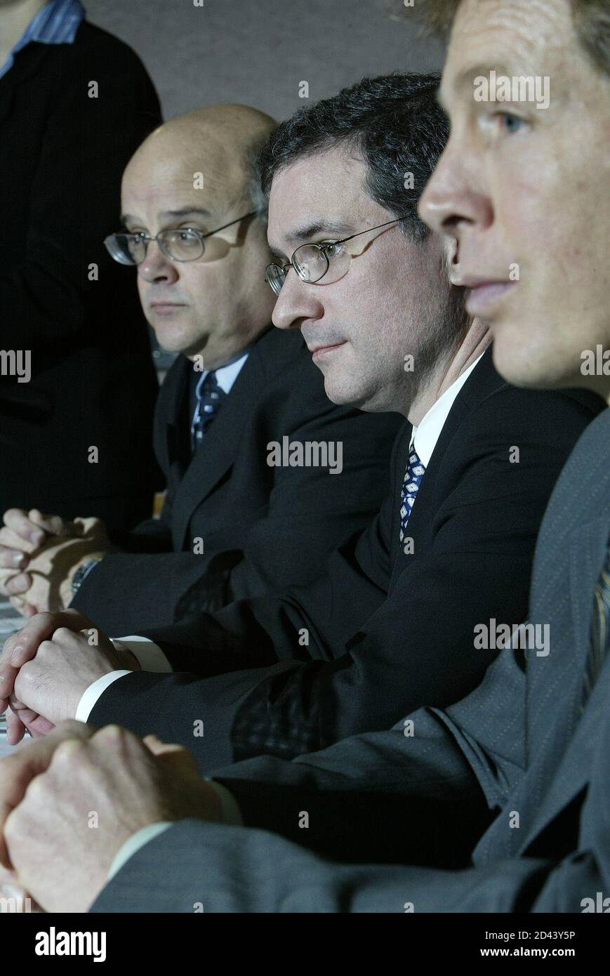 Sandy McDade, President of Weyerhaeuser Company Limited, (L), Sam Pollock, Managing Partner and President of Brascan Investments, (C) and Reid Carter, Managing Partner of Brascan Timberlands Asset Management hold a press conference in Vancouver British Columbia, February 18, 2005. Brascan will purchase Weyerhaeuser's costal assets in Canada for 1.2 billion (CDN), 970 million (USD) plus working capital. REUTERS/Lyle Stafford LS Stock Photo