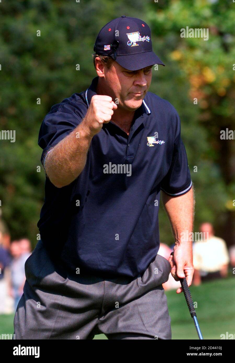 American Hal Sutton celebrates his birdie putt on the first hole of  President's Cup play at the Robert Trent Jones Golf Club in Lake Manassas,  October 21, 2000. Sutton and his partner