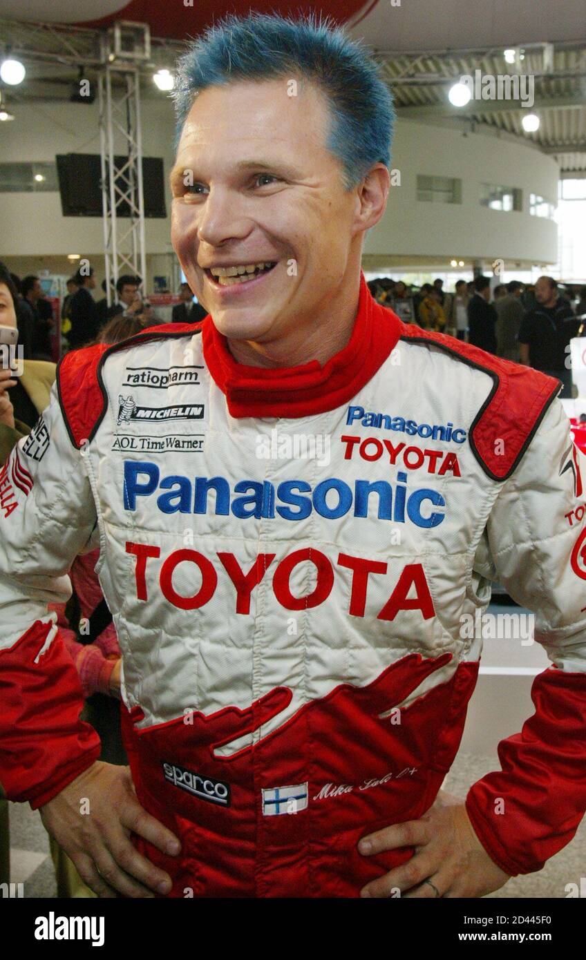 Formula One driver Mika Salo of Finland smiles as he speaks to reporters in  Tokyo October 9, 2002. Salo is competing at the Japanese Grand Prix at  Suzuka Circuit in central Japan