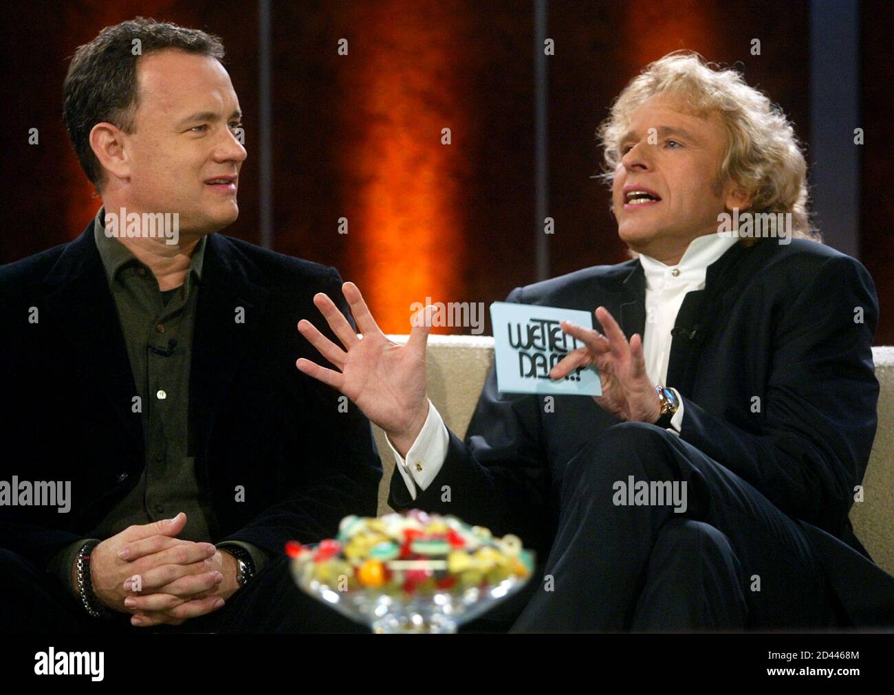 U.S. actor Tom Hanks (L) talks to German TV host Thomas Gottschalk during  the TV show "Wetten, dass...?!" (Bet It...?!) in the southern German town  of Boeblingen near Stuttgart January 25, 2003. "