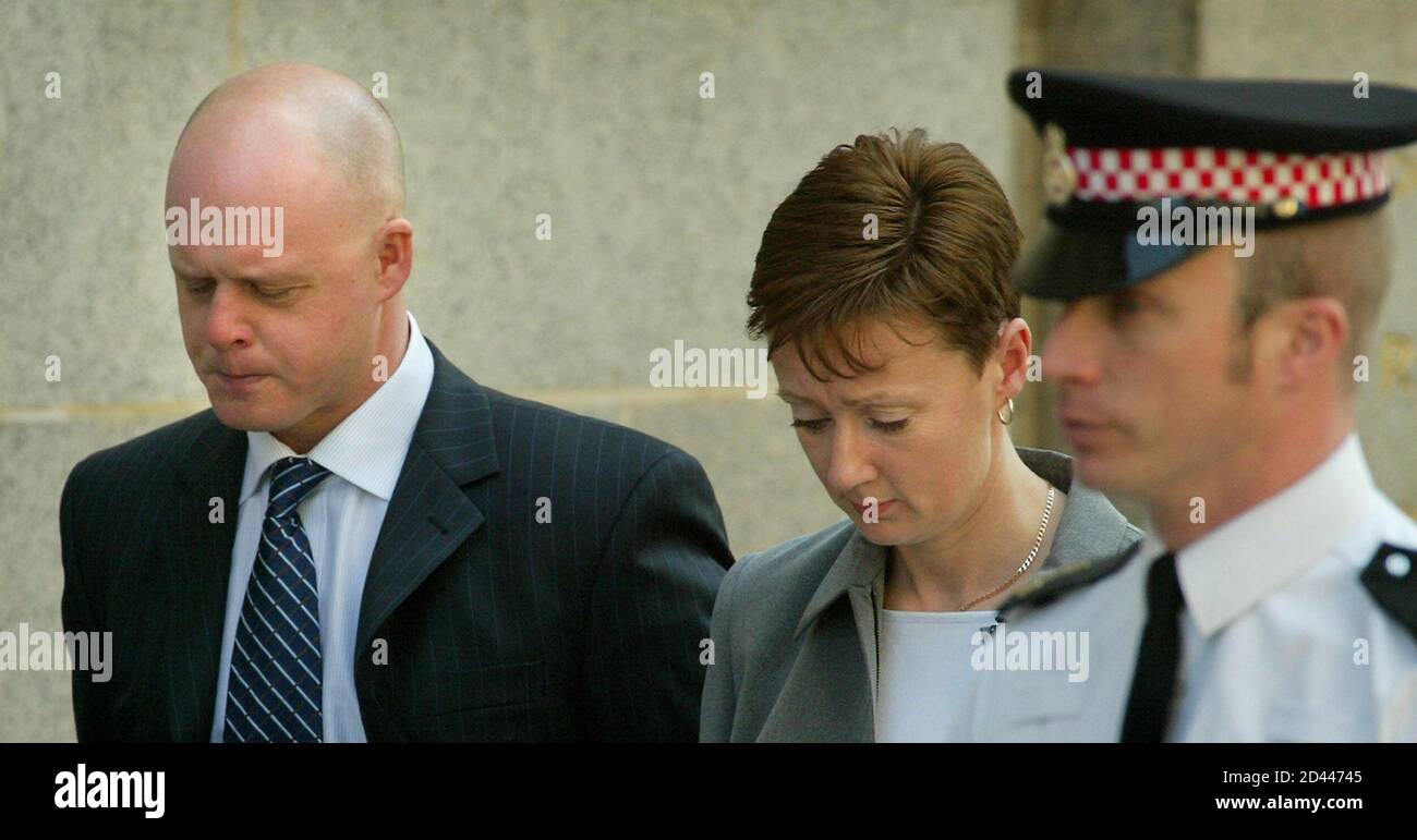 Parents of murdered Soham schoolgirl Holly Wells, (L-R) Kevin and Nicola, leave the Old Bailey in London, April 16, 2003. Former school caretaker Ian Huntley on Wednesday denied killing two schoolgirls Holly Wells and Jessica Chapman from Soham in Cambridgeshire, Britain in August 2002, in a double murder which shocked the country and sparked calls for a return of the death penalty. Huntley's girlfriend at the time of the deaths, former teaching assistant Maxine Carr, denied two charges of helping an offender and a charge of perverting the course of justice. REUTERS/Peter Macdiarmid  PKM/ASA Stock Photo