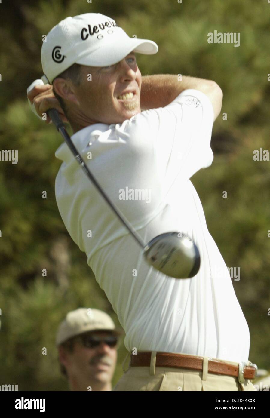 Jonathon Kaye watches his tee shot on the 10th hole during the first round of The International, at Castle Pines golf club in Castle Rock, Colorado, August 7, 2003. Kaye is the early leader in the modified Stableford scoring tourney. REUTERS/Gary C. Caskey  GCC/GN Stock Photo