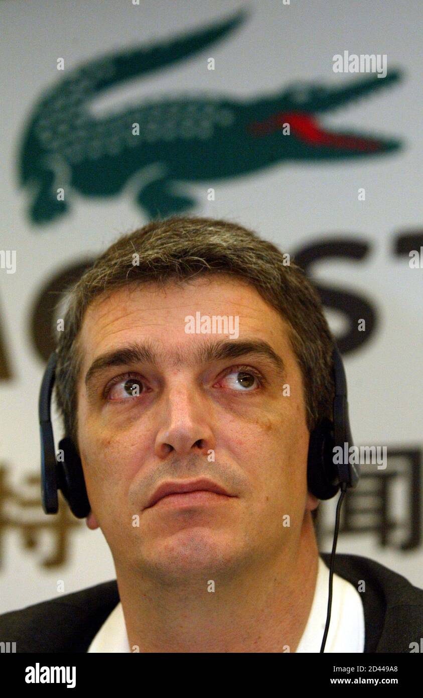 Philippe Lacoste, director of French retail giant Lacoste and grandson of  founder Rene Lacoste, listens to a question during a press conference in  Shanghai March 29, 2004. French retailer Lacoste, frustrated over