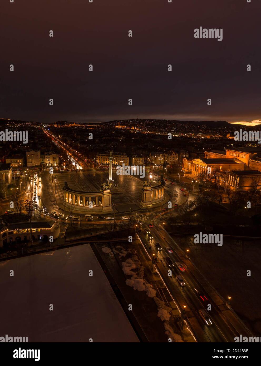 Aerial drone shot of Heroes Square in the night in Budapest winter with ...