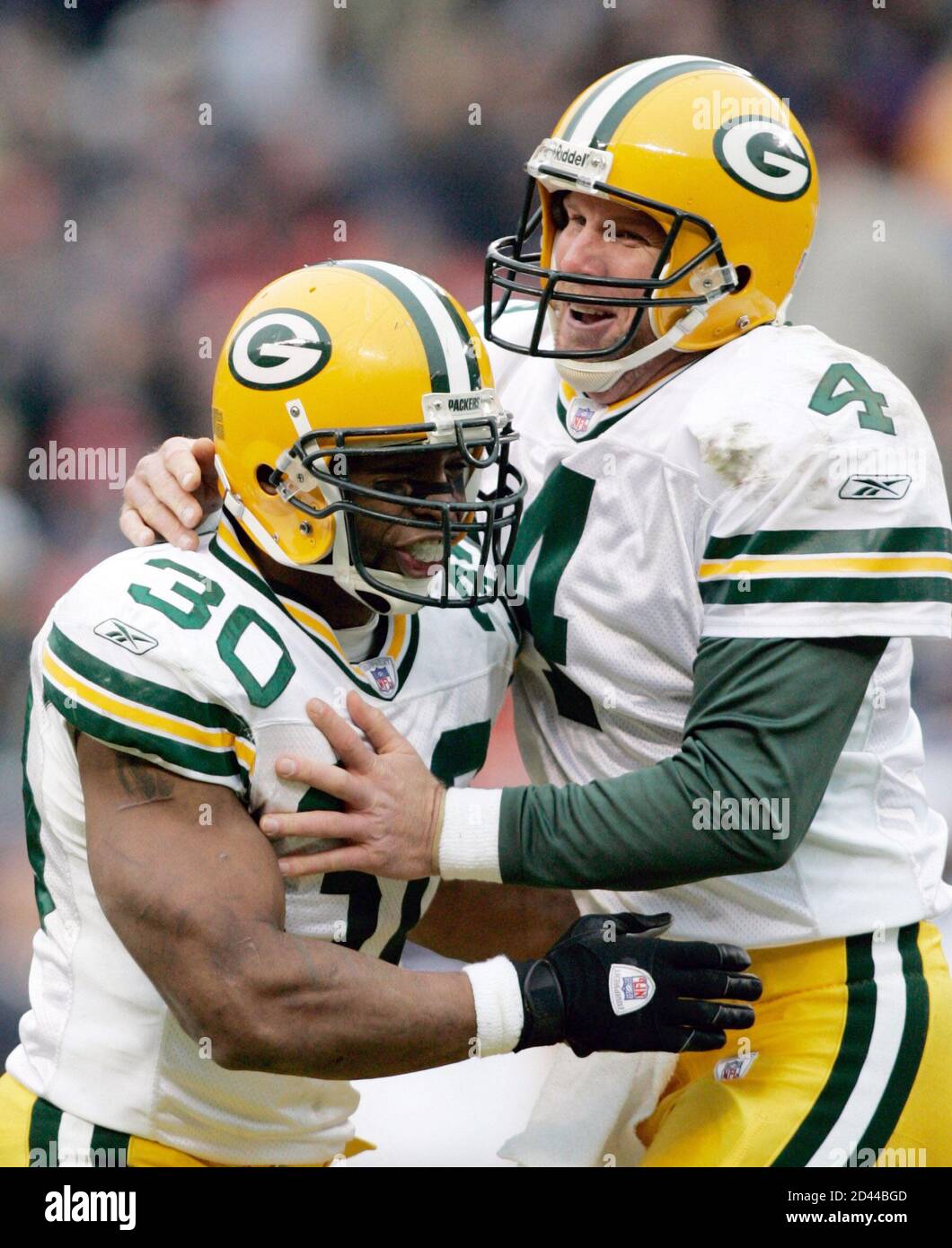 Green Bay Packers Quarterback Brett Favre R And Running Back Ahman Green 30 Celebrate After Favre Threw A 38 Yard Touchdown Pass To Fullback William Henderson During The First Half Against The Chicago