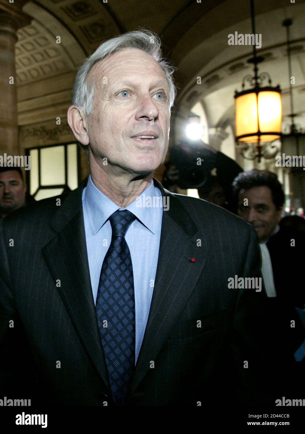 Michel Roussin, former cabinet director for [Jacques Chirac] during his term as mayor of Paris (1984-86) and as prime minister (1986-88), arrives at court with lawyers on the opening day of trial in Paris, March 21, 2005. Roussin is one of forty-seven people which includes four former ministers, who stand trial in the illicit funding of several French political parties. Stock Photo