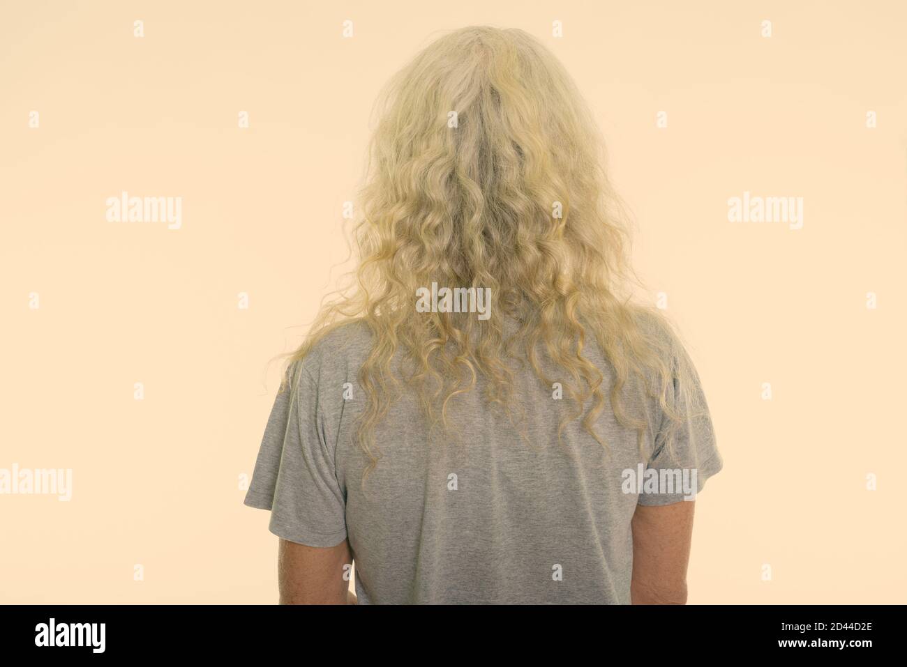 Close up back view of senior bearded man with long curly white hair Stock Photo