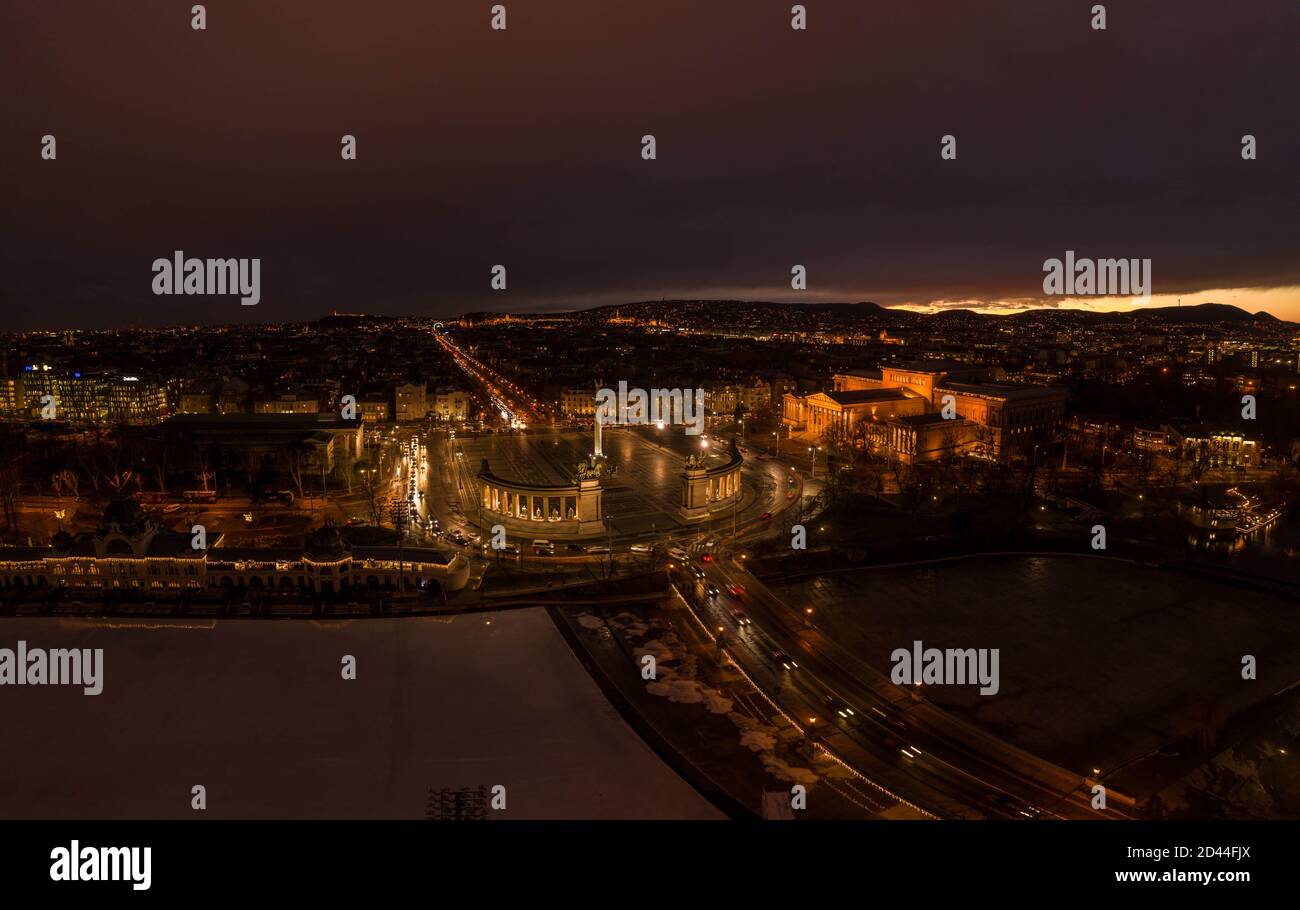 Aerial drone shot of Heroes Square in the night in Budapest winter with ...