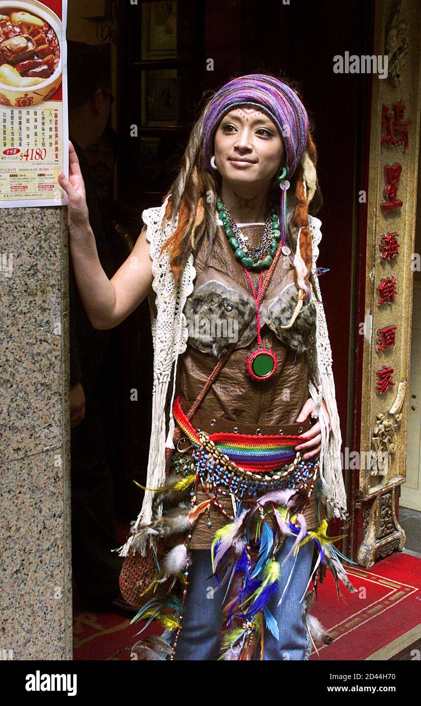 Japanese pop queen Ayumi Hamasaki walks out of a Hong Kong restaurant in Central after lunch February 22, 2002. [She took home an award for the most influential Japanese singer in Asia during the MTV Asia Awards in Singapore earlier in the month.] Stock Photo