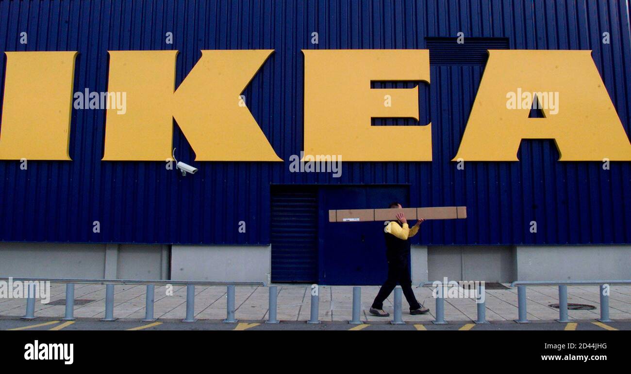 An employee of an IKEA store in the northern Greek town of Thessaloniki  carries furniture parts December 4, 2002. Police sealed off 10 IKEA stores  in the Netherlands after bombs found in