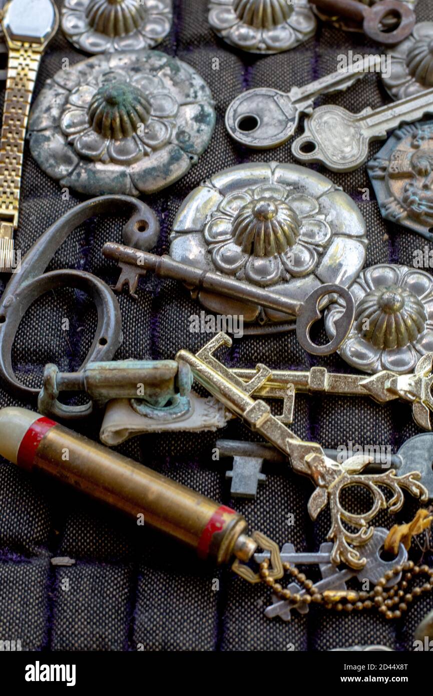still life of fancy keys and decorative items for sale in a antique store display Stock Photo