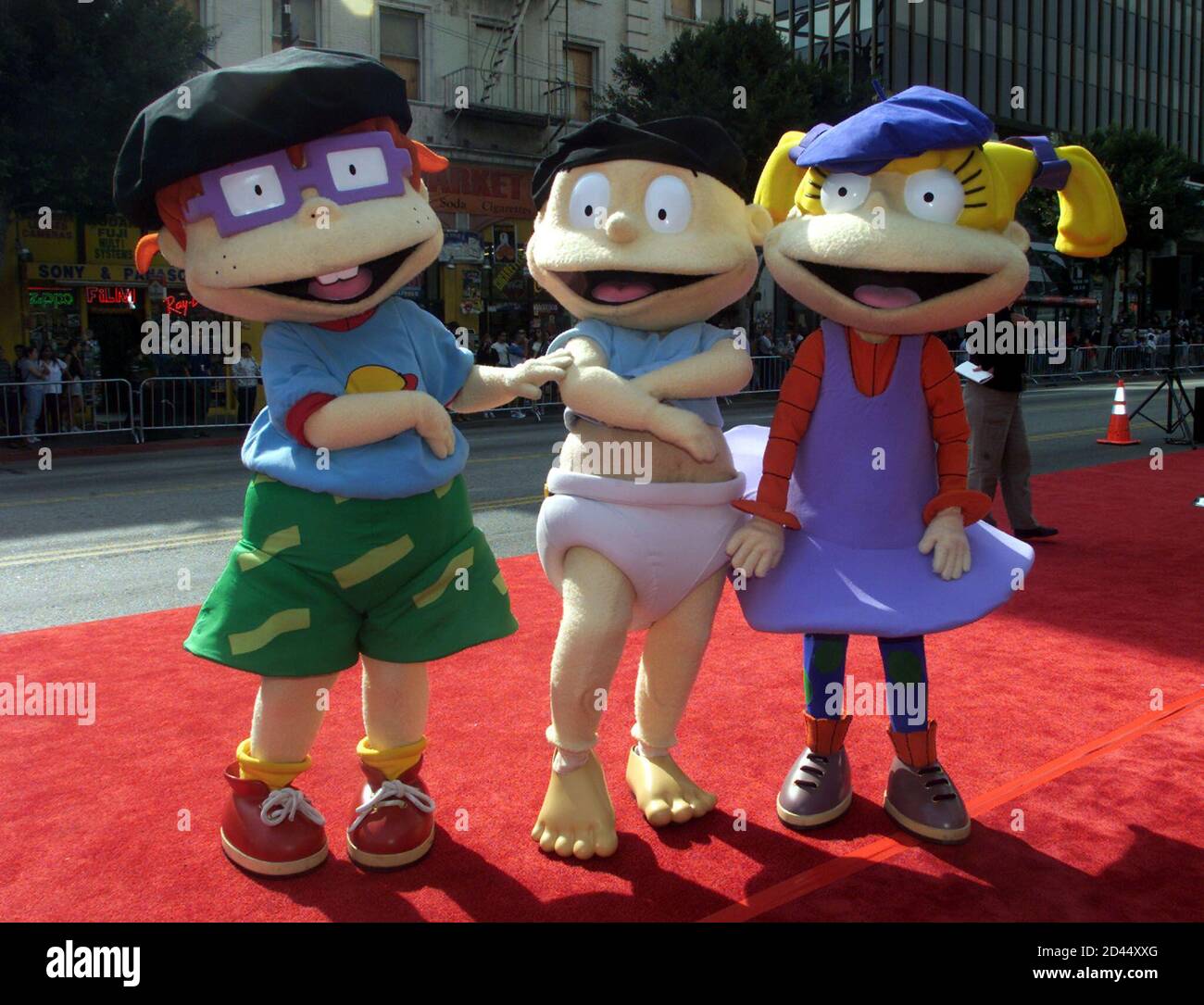 Rugrats characters (L-R)  Chuckie Finster, Tommy and Angelica Pickles pose for photographers at the premiere of the animated film 'Rugrats In Paris-The Movie' November 5, 2000 in Hollywood. The film opens November 17 in the United States. Stock Photo