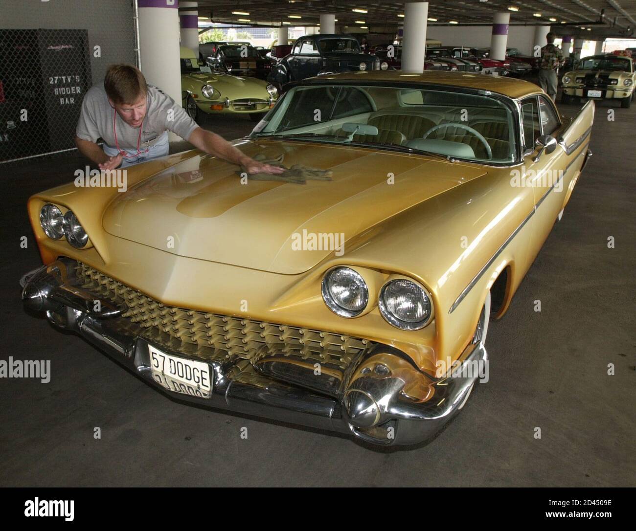 Workman Bob Knowles makes finishing touches on a 1957 Dodge Royal Lancer Custom owned by Brian Setzer June 14, 2001 at the Petersen Automotive Museum in Los Angeles. The museum's exhibit, 'The Cars & Guitars of Rock & Roll,' commemorating 50 years of the genre, opens June 15 through December 31, 2001. Setzer's car will be offered at auction this weekend.  JR/JP Stock Photo