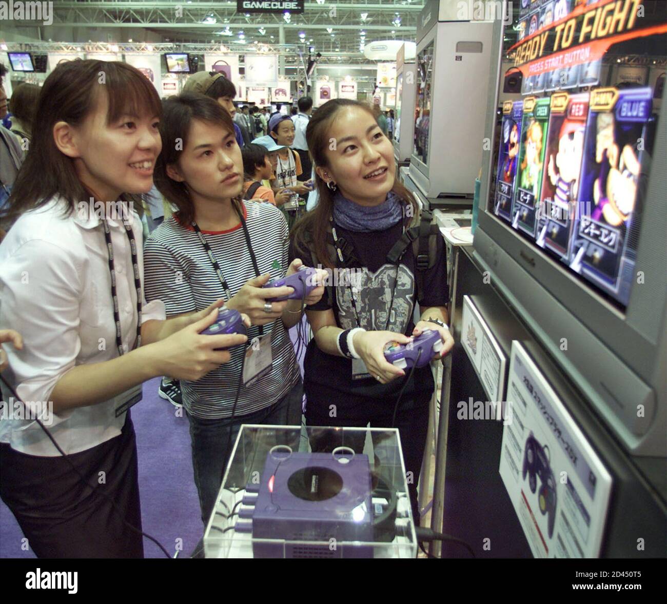 Japanese women play the new Nintendo GameCube video game console at Nintendo  Space World 2001 in Makuhari, 30 kilometre east of Tokyo August 24, 2001.  The world's second-largest home video-game maker Nintendo