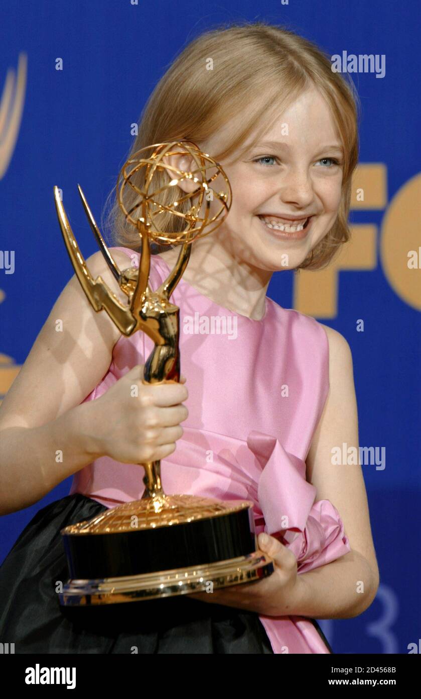 Young actress Dakota Fanning holds the Emmy Award for Outstanding  Miniseries for "Steven Spielberg Presents Taken" at the 55th annual Emmy  Awards in Los Angeles September 21, 2003 Stock Photo - Alamy