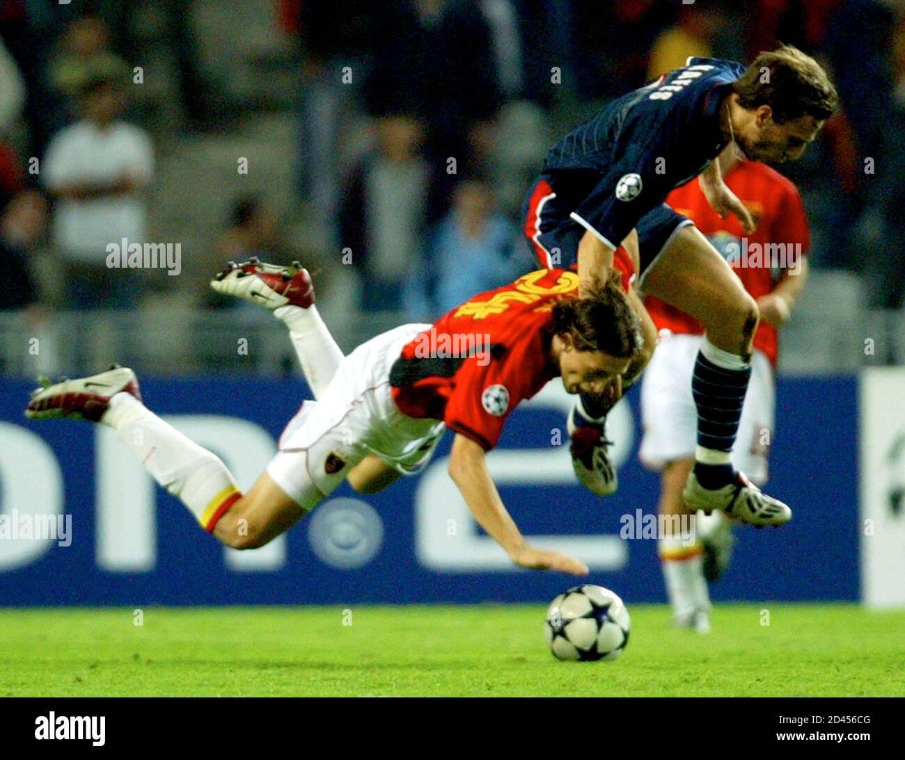 Galatasaray's Romanian midfielder Ovidiu Petre (L) is brought down by  Pantelis Kafes (R) of Olympiakos during their Champions League Group D  match in Istanbul October 21, 2003. Galatasaray beat Olympiakos 1-0.  REUTERS/Fatih